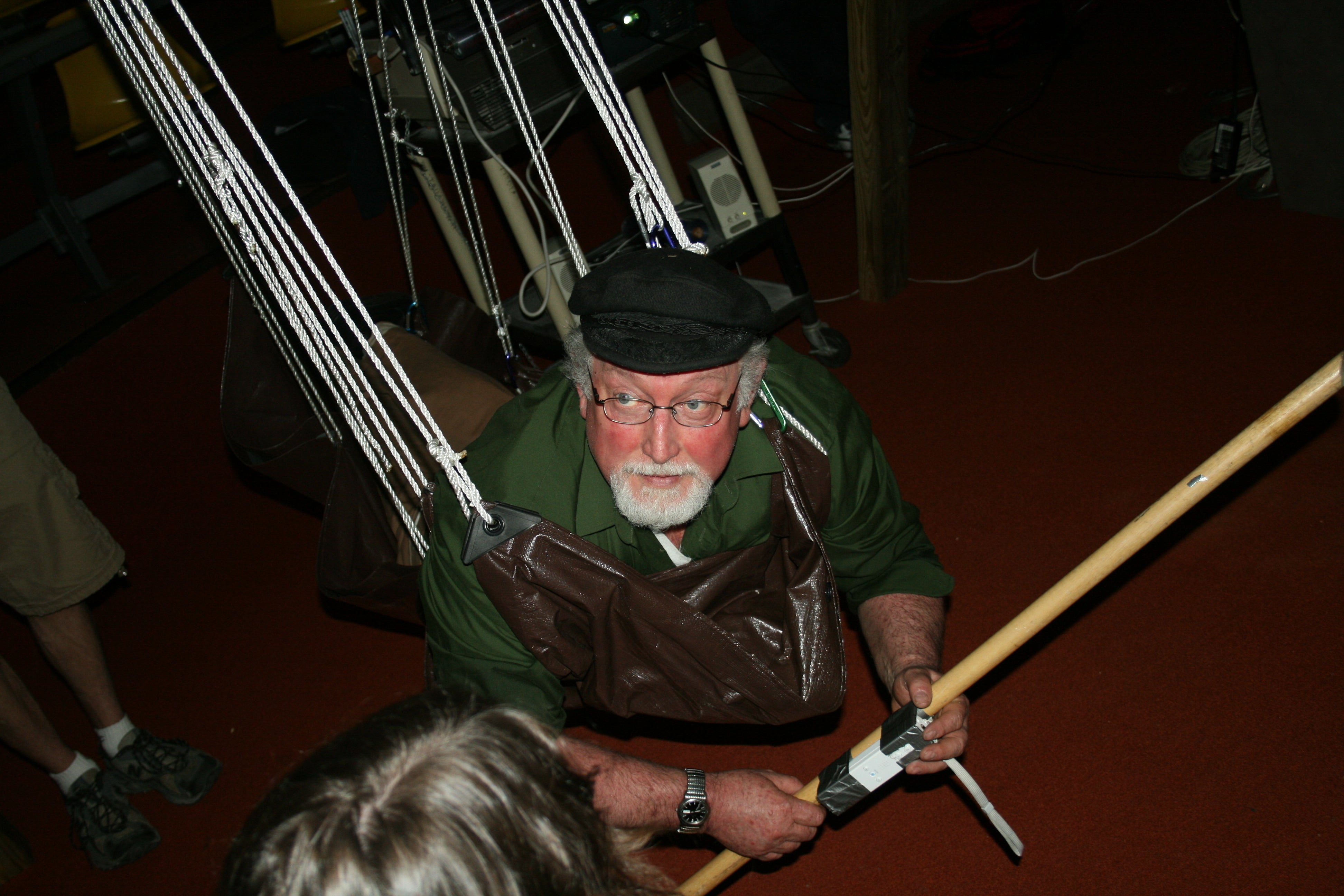 Ralph Noble suspended from a wooden frame at GameFest 2008.
