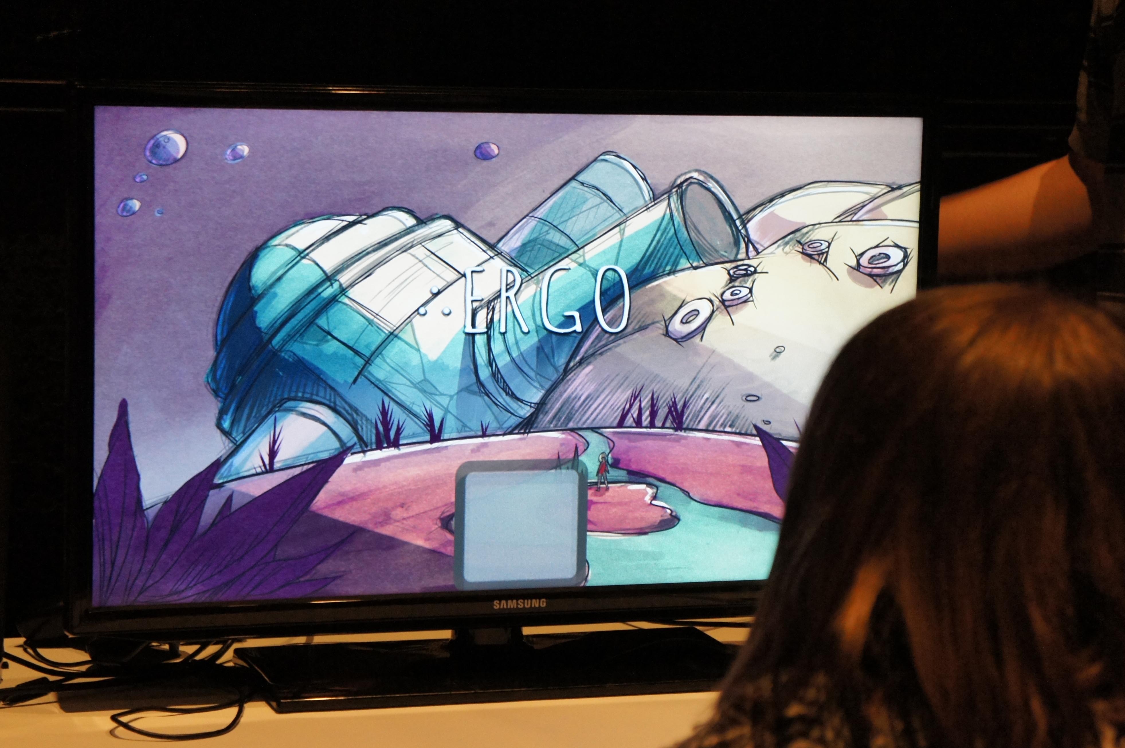 Student looking at the title screen of Ergo at GameFest 2016.